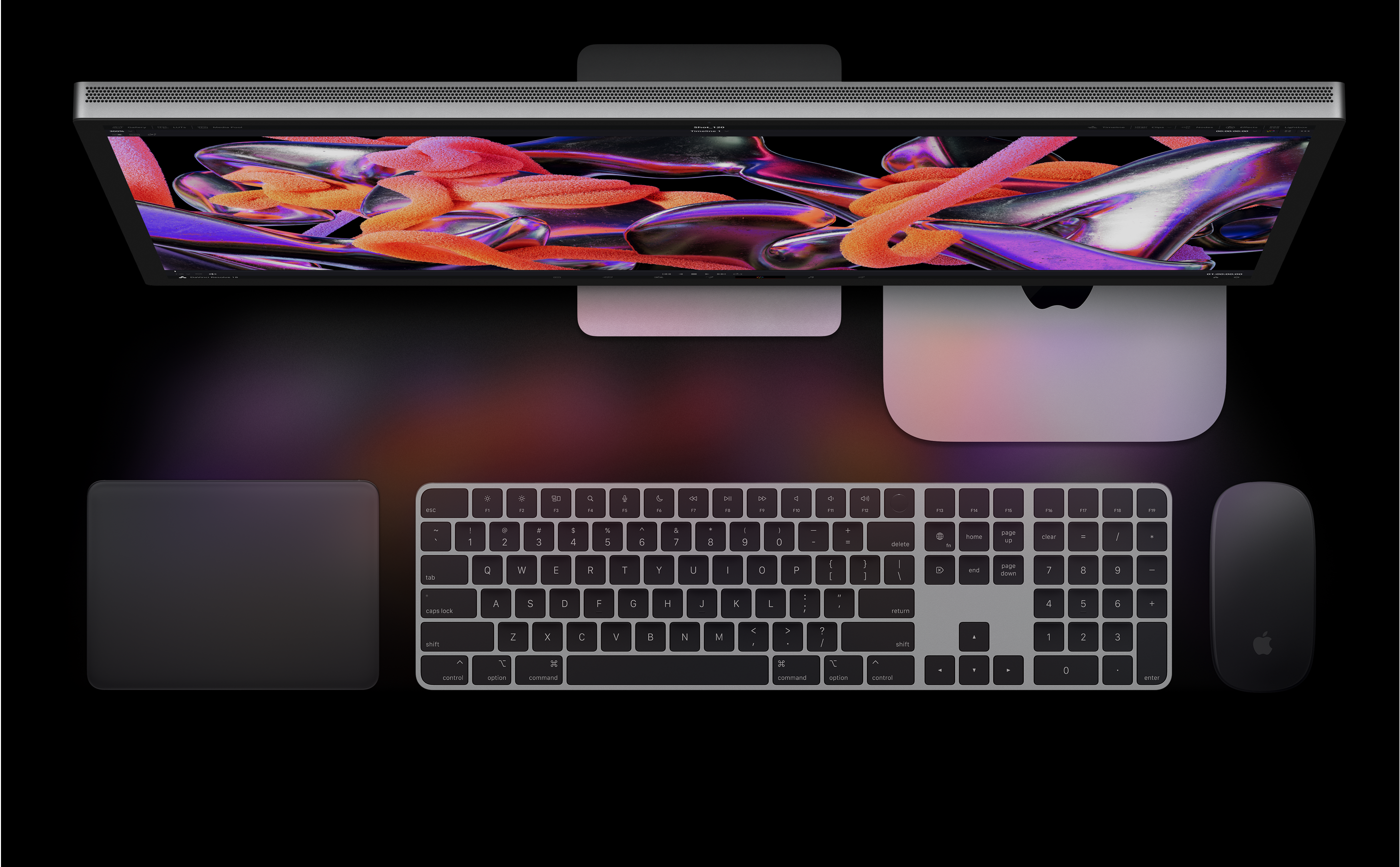 A Studio Display, a Mac mini, a Magic Trackpad, a Magic Keyboard és a Magic Mouse felülnézetből.