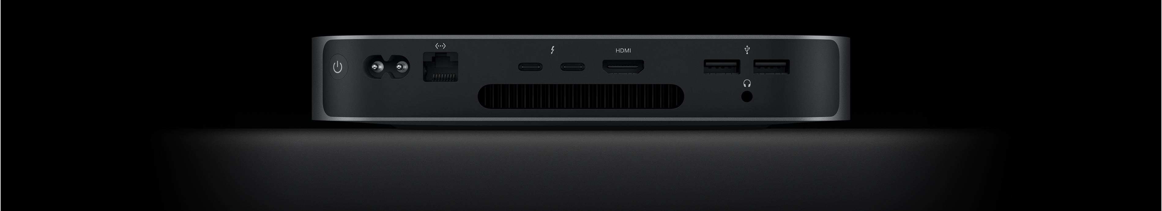 A Mac mini hátulnézeti képe, melyen a két Thunderbolt 4 port, a HDMI-port, a két USB‑A port, a fejhallgató-csatlakozó, a gigabites Ethernet-port, a tápcsatlakozó és a bekapcsológomb látszik.