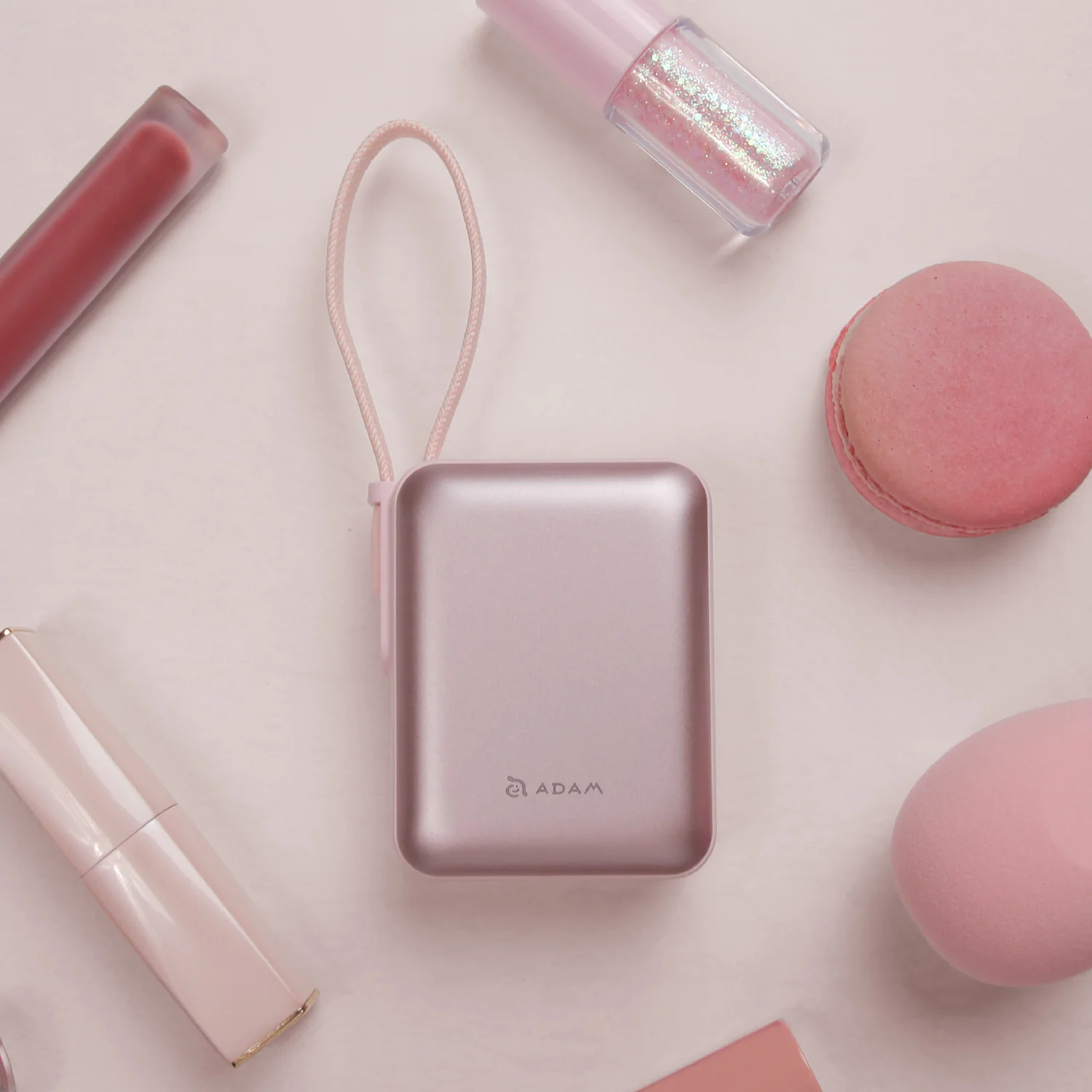 ADAM elements VIONTA Q 10 000 mAh kompakt powerbank beépített kábellel - rózsaszín